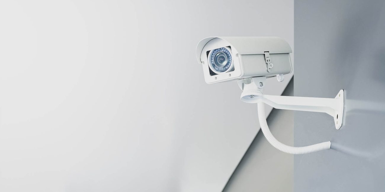 Illustrative photograph of a wall-mounted CCTV camera
