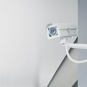 Illustrative photograph of a wall-mounted CCTV camera