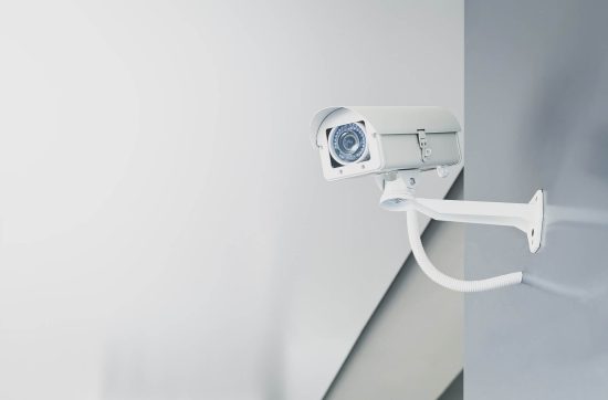 Illustrative photograph of a wall-mounted CCTV camera