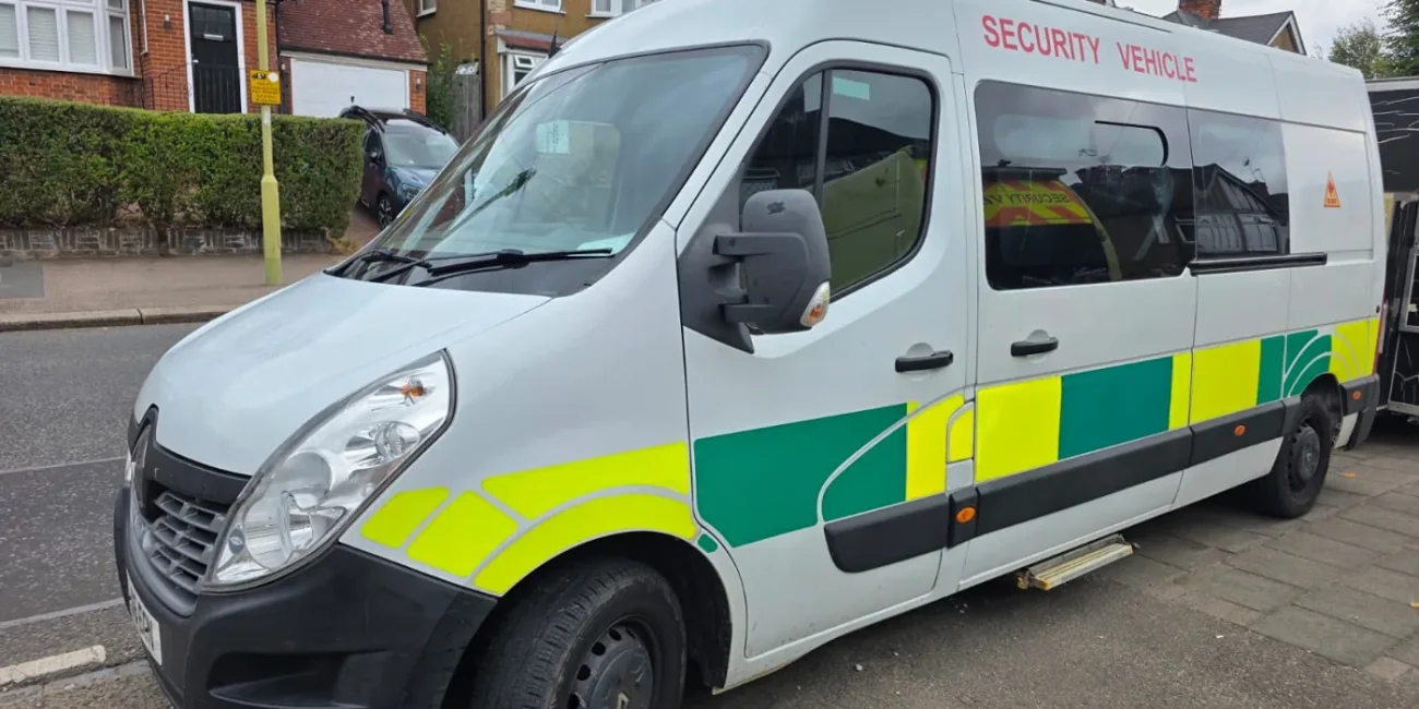 White security van with yellow and green markings