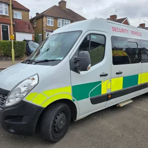White security van with yellow and green markings