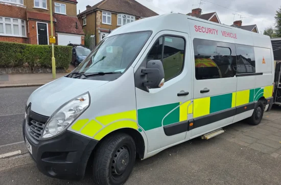 White security van with yellow and green markings